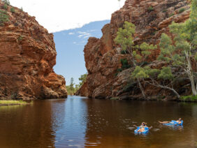 Couple floating at Ellery Creek Big Hole